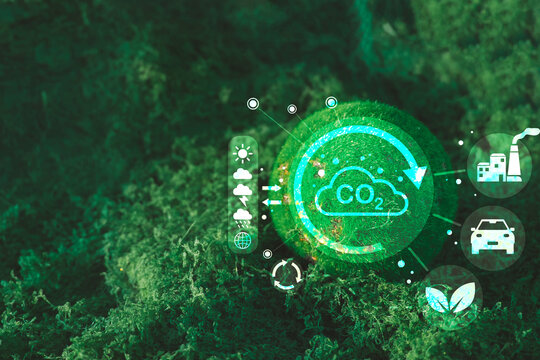 Carbon neutrality and net zero concept. Glowing green moss sphere with digital CO2 emission graphics, factory, and car icons against natural background for ESG and climate change awareness.