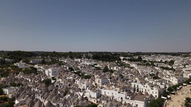Aerial panoramic view of alberobello's historic town center with its distinctive trulli houses, an iconic unesco world heritage site in the apulia region of italy