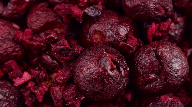 Red whole freeze dried cherry berries circle rotation close up