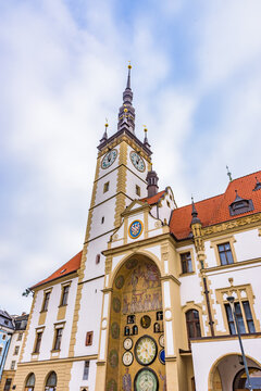 Low angle view of the historic Olomouc Town Hall with its high clock tower and astronomical clock in Czechia.