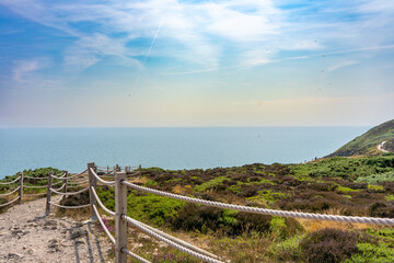 Fototapeta premium Wooden Rope Fence Along the Howth Cliff Walk Above the Irish Sea