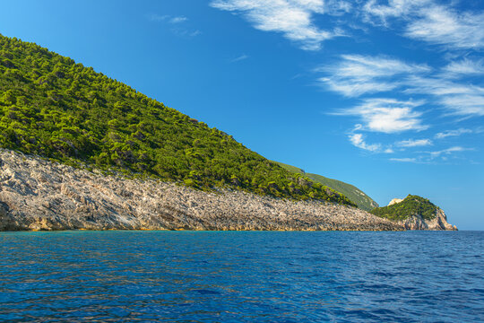 Zakynthos coast showing green hills and blue Ionian sea.