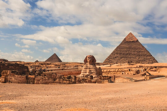 Sphinx and Giza Pyramids on a cloudy day - Cairo, Egypt
