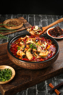 Spicy Blackened Fish Fillets in Red Chili Oil with Asian Seasonings and Vegetables