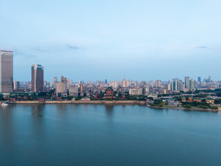 Obraz premium A beautiful panoramic view of the modern city skyline and riverfront buildings in Nanchang City located in Jiangxi province of China during a clear summer day
