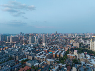 Fototapeta premium A wide aerial view of the urban cityscape in Nanchang City located in the Jiangxi province of China during a clear afternoon