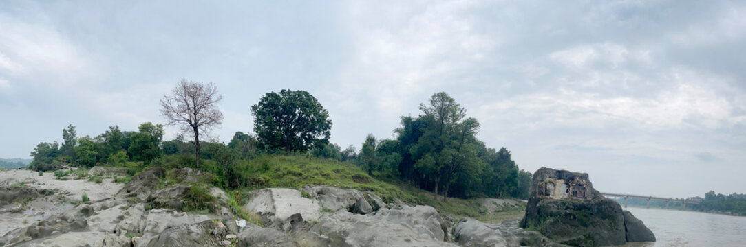 riverbed rock beside river beas nadaun with water and trees 102