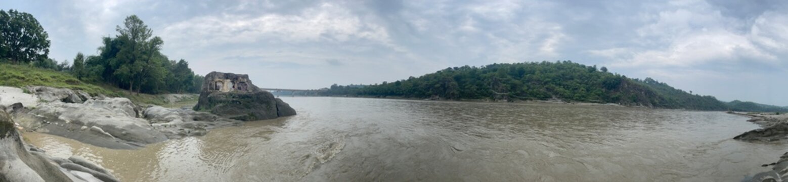 riverbed rock beside river beas nadaun with water and trees 103