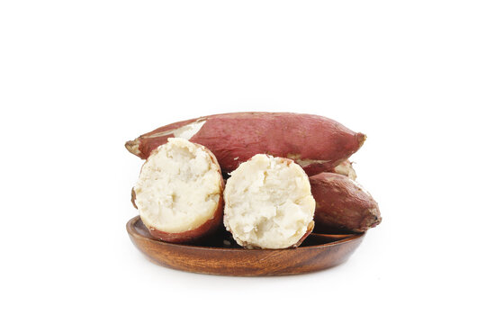 Sweet Potatoes with White Flesh on Wooden Plate - Fresh Root Vegetables