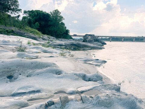  serene riverbanks and exposed bedrock of the beas River near nadaun himachal pradesh india
