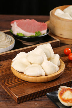 Fresh Handmade Chinese Dumplings with Pork Meat and Bamboo Steamer Traditional Asian Cuisine