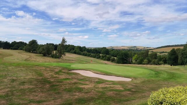 Marlborough Wiltshire England UK. 28.06.2026. Expansive view of a beautifully maintained golf course featuring sand traps, manicured greens, and distant rolling hills 