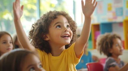 Fototapeta premium Happy elementary student with hand raised in classroom