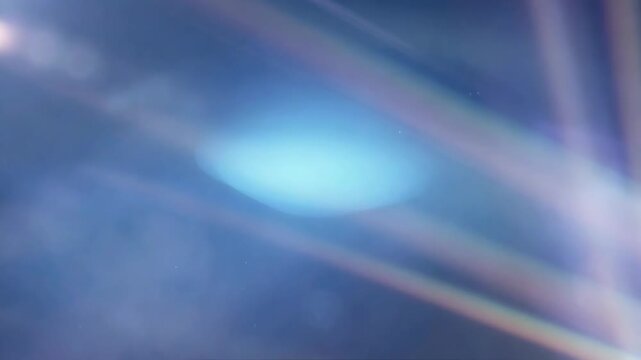 Abstract blue light streaks with soft glow in an abstract style on a dark gradient background, conveying serenity and motion