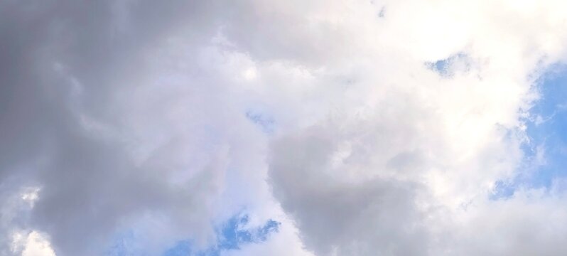 Dramatic cloudy sky during late afternoon in Bandung, Indonesia, with soft grey and white cloudscape background