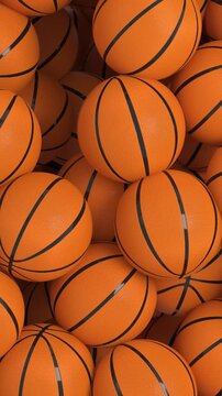 4k Resolution Vertical Video for Social Media: Basketball Sports Concept. Animated Falling Orange Basketballs Forming Piles On White Background With Alpha Matte