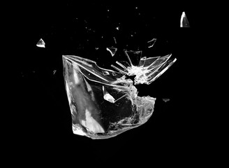 Black and white fairy tale castle with princess formed from crystal glass ice and shiny abstract materials isolated on white with splashing water and reflective elements © Ashok