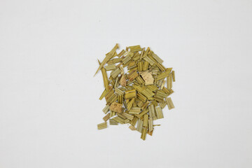 Dried chopped herbal leaves isolated on white background © DinhBaoTran
