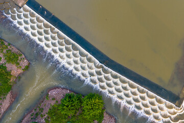 Aerial View of Fish Scale Weir and Cascading River Water © TrieuHao