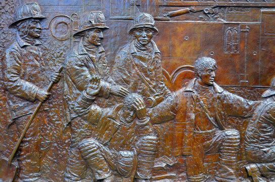 NEW YORK UNITED STATES OF AMERICA: The FDNY Memorial Wall at Engine 10 Ladder 10 (the "Ten House") is a 56-foot-long cast-bronze bas-relief sculpture 