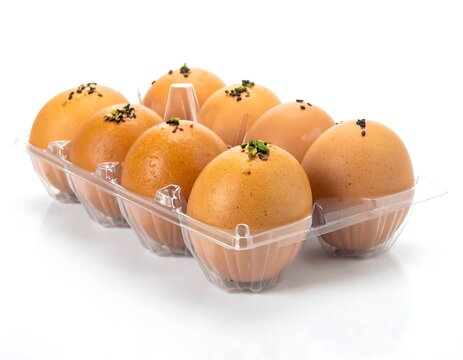 Eggs in plastic container.