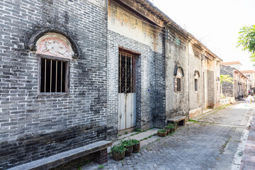 Fototapeta premium Historic Chinese Village Alley with Traditional Gray Brick Houses