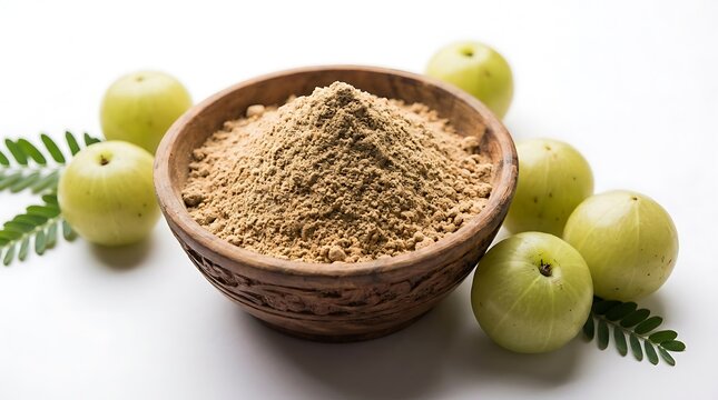 Amla powder in a bowl with fresh green indian gooseberry fruits on a wooden table. amla powder