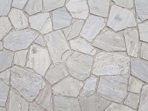Realistic Top Down Pale Gray Natural Stone Pavement Texture Background with Irregular Polygon Slabs, Soft Mineral Detail, Subtle Mortar Joints, and Full Frame Mosaic Surface