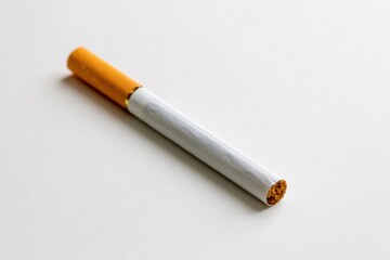 Obraz premium The Cigarette On White Background Captured In Minimal Studio Light