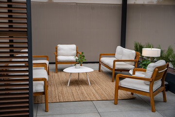 Fototapeta premium Modern terrace lounge with white armchairs