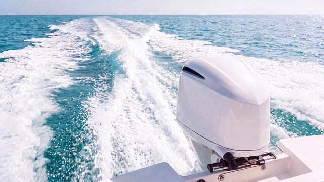 Boating concept for outboard motor marine recreation and ocean travel in nautical leisure watercraft cruising and coastal summer vacation on open blue sea