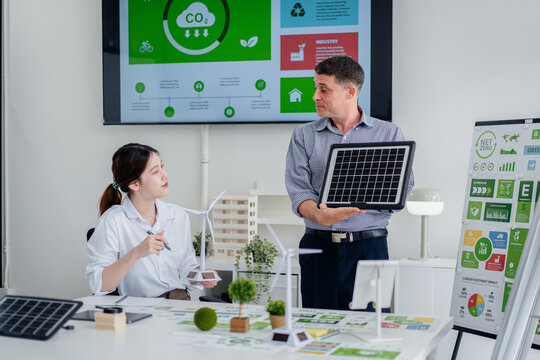 Business Leaders Strategizing Carbon Reduction ESG Initiatives I