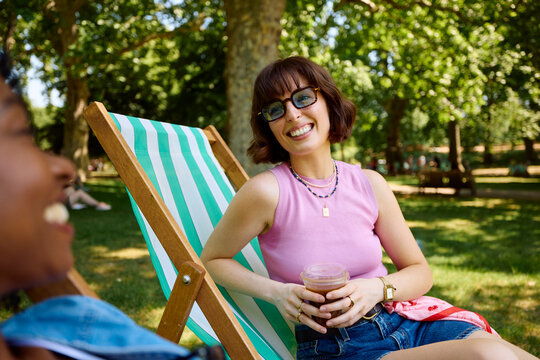 Friends Spend Time In A Park Talking
