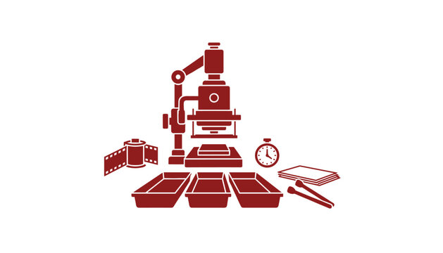 Vintage darkroom photography equipment, including a film enlarger, film roll, timer, and chemical developing trays.
