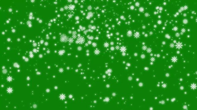 4k magical light rays bursting into falling snowflakes on green screen for winter video effects