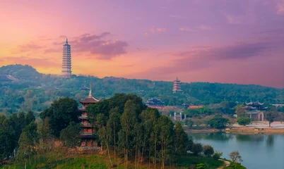 Aerial Scenic view of Bai Dinh pagodas and mountains at sunset in Ninh Binh, Vietnam © Parilov