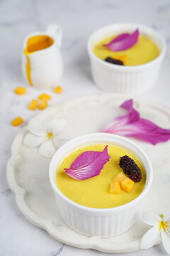 yellow dessert with fruits and flowers