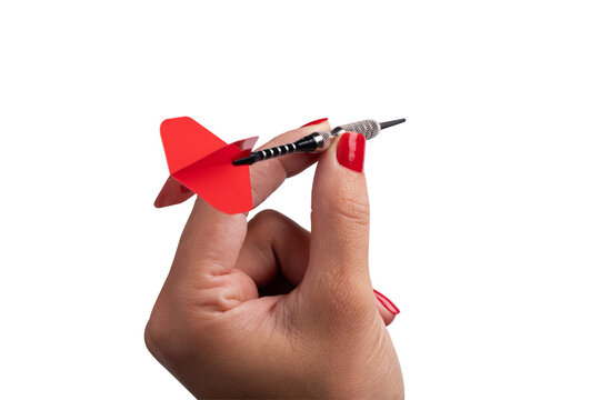 Close-up of a female hand with red nails holding a red dart isolated on transparent symbolizing precision, focus, and success.