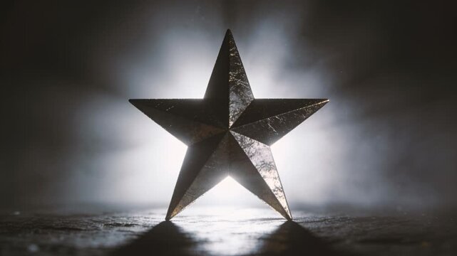 Pulsing backlight sending metallic five-point star shimmering on textured tabletop, with halo haze