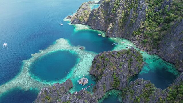 Stunning aerial footage revealing the turquoise waters and karst cliffs of twin lagoon in coron, palawan