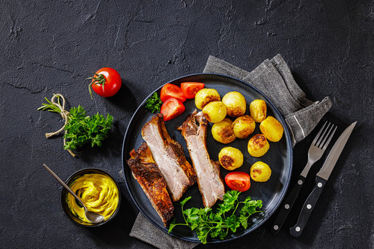 Roasted Pork Ribs with browned baby potatoes