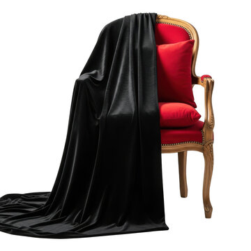 A red chair with a black cloth draped over it