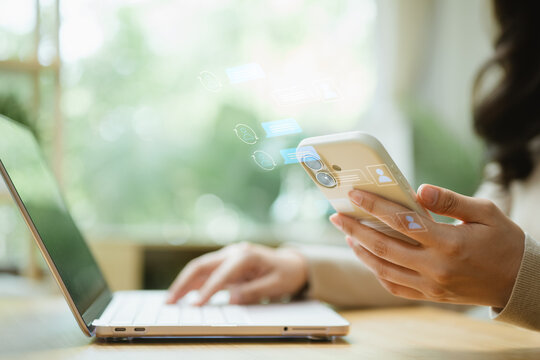 Professional using smartphone and laptop for live chat and customer support, enabling fast digital communication, online assistance and service efficiency.