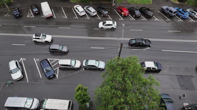 Aerial Slow Motion Shot of Cars on Wet Street During Rain Today
