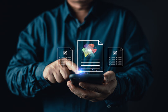 Close up of businessman holding smartphone to manage digital documents with virtual ai assistant icon for automation compliance validation and technology solutions in dark studio.