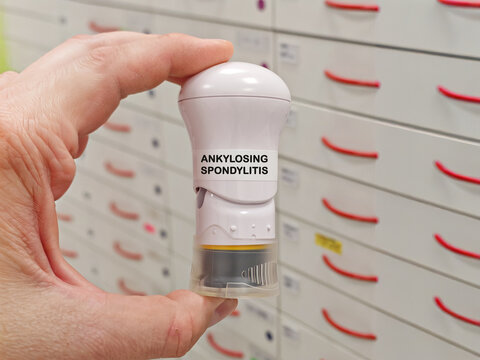 ANKYLOSING SPONDYLITIS medical concept with an autoinjector