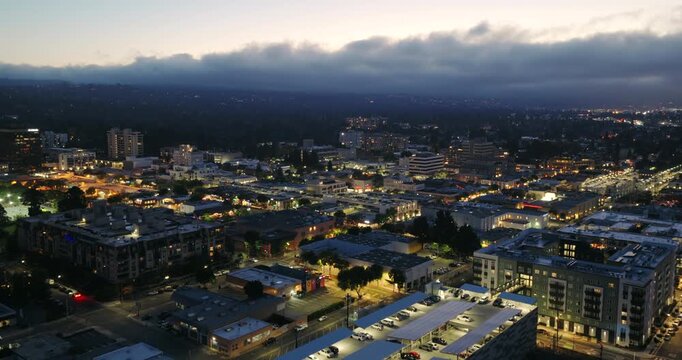 San Mateo California - Aerial View of Downtown at Night with Rolling Fog in Background Facing West 