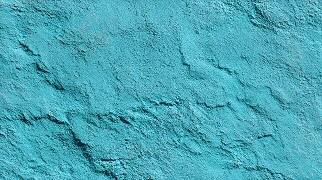 Textured turquoise stucco wall surface with organic rough patterns and shadows