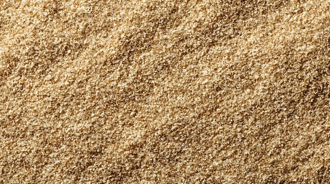 Close-up view of fine warm beige sand with a smooth, even texture