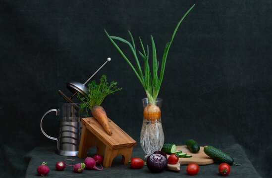 Still life with fresh vegetables on a dark green background